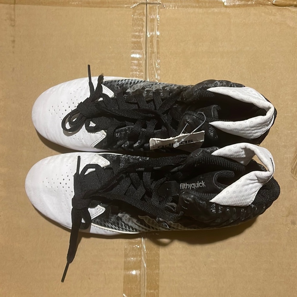 Brand new black and white Adidas Cleats